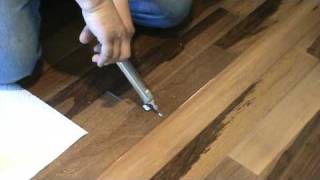 how to repair a popping floor gluedownor floating PART 1 [upl. by Ecirehs]