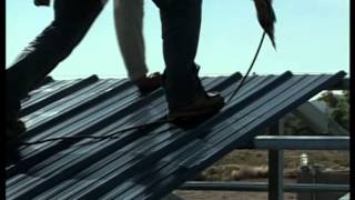 Metal Building Installation Step 19 Roof Panels [upl. by Waldman]