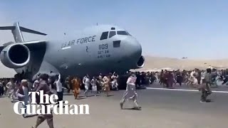 Afghans climb on to plane during takeoff in attempt to flee Taliban [upl. by Eyoj282]